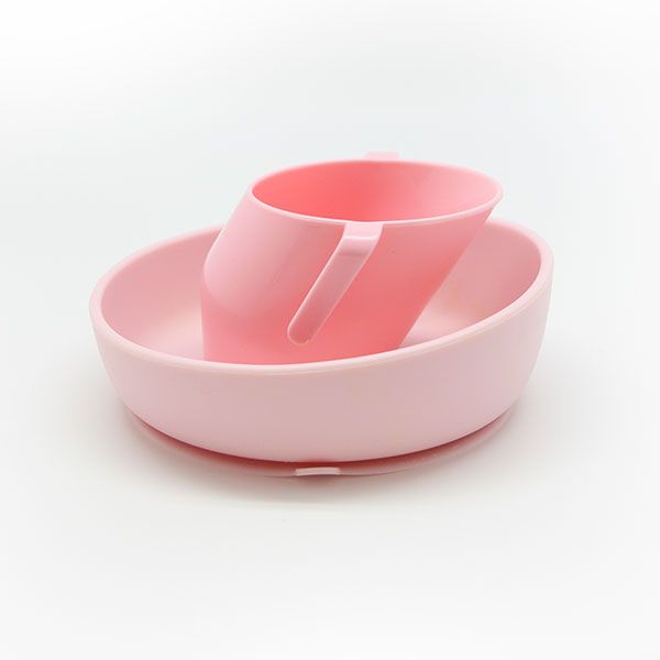 Plato y taza de la marca Doidy de color rosa